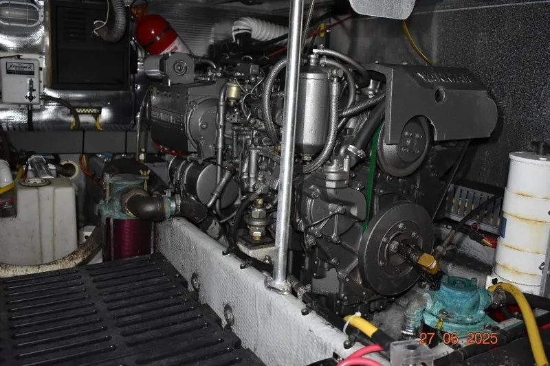 Talisman Yacht Photos Pics Engine room of 2003 Mainship 430 Aft Cabin Trawler, showcasing detailed machinery components.