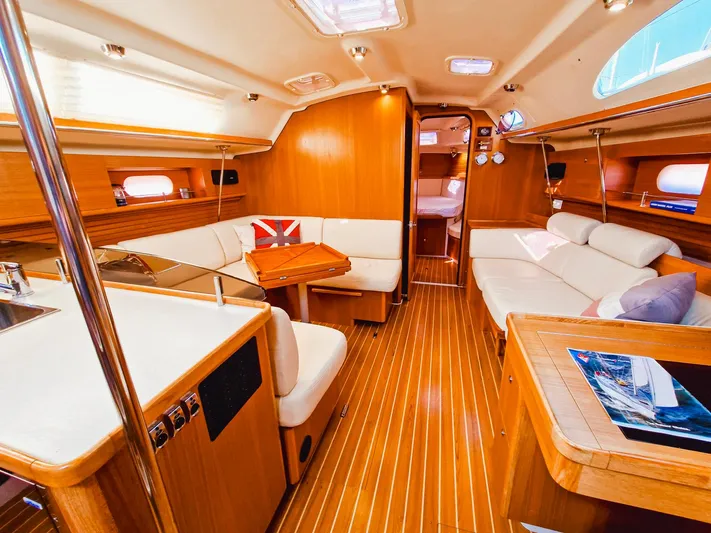  Yacht Photos Pics Luxurious interior of a 2011 Catalina 445 yacht with wooden finishes and comfortable seating.