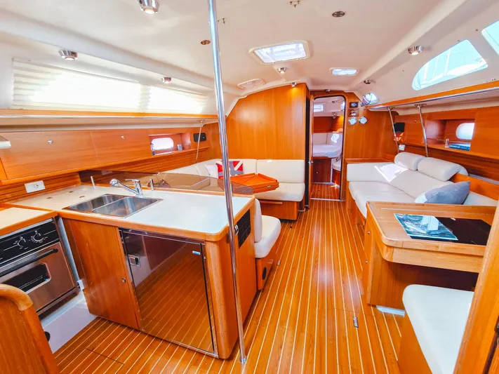  Yacht Photos Pics Luxurious interior of a 2011 Catalina 445 yacht with modern kitchen and seating area.