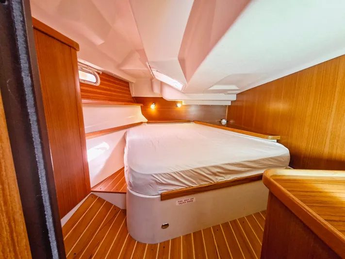  Yacht Photos Pics Luxurious cabin interior of 2011 Catalina 445 yacht with wooden finishes and cozy bed.