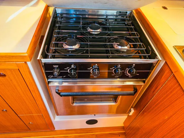  Yacht Photos Pics Stainless steel stove with four burners in a 2011 Catalina 445 yacht kitchen.