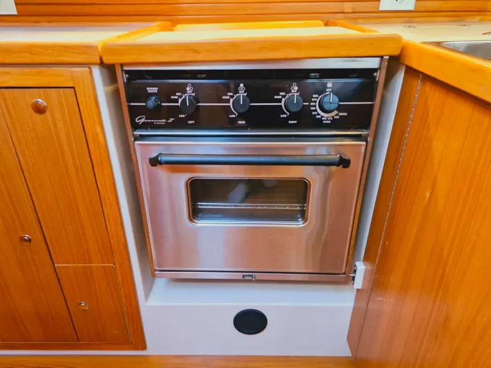  Yacht Photos Pics Stainless steel oven in 2011 Catalina 445 yacht kitchen with wooden cabinetry.