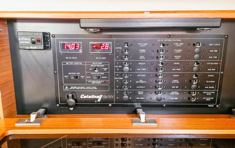  Yacht Photos Pics Electrical control panel of a 2011 Catalina 445 yacht with various switches and digital displays.