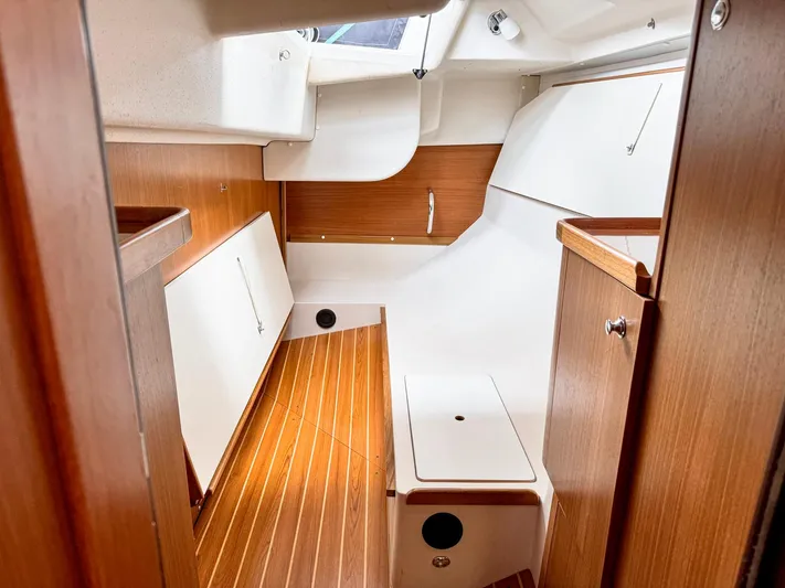  Yacht Photos Pics Interior of 2011 Catalina 445 sailboat with wood accents and white cabinetry.
