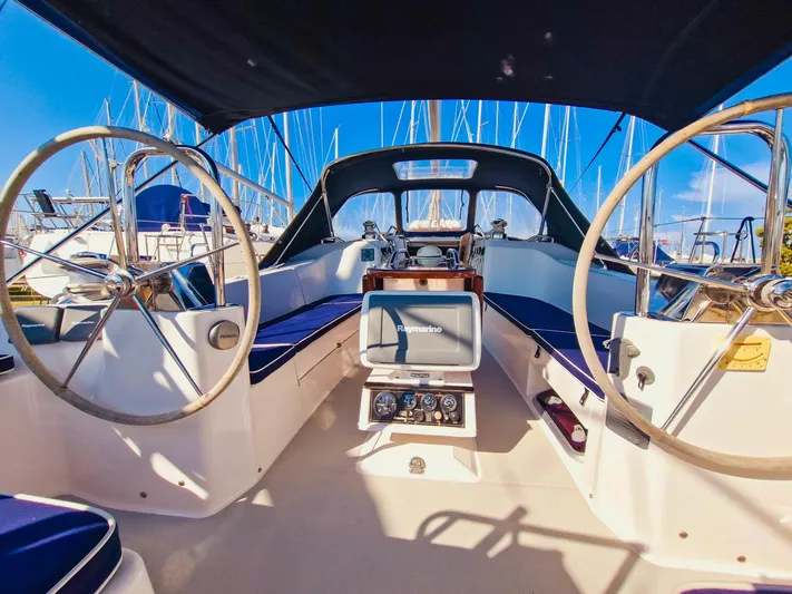  Yacht Photos Pics Cockpit of 2011 Catalina 445 sailboat with dual steering wheels and navigation equipment.