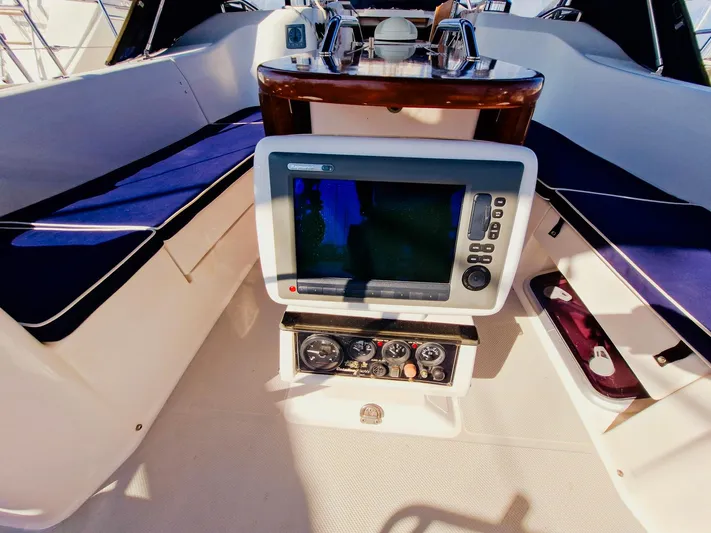  Yacht Photos Pics Cockpit of 2011 Catalina 445 sailboat with navigation equipment and seating.