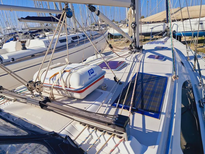  Yacht Photos Pics 2011 Catalina 445 sailboat deck with liferaft and solar panel in marina.