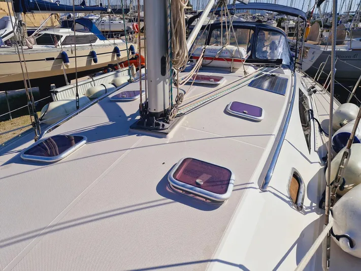  Yacht Photos Pics 2011 Catalina 445 sailboat deck with hatches, docked in a marina.