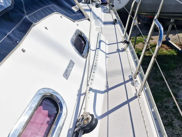  Yacht Photos Pics 2011 Catalina 445 sailboat deck with stainless steel railings and cabin windows.