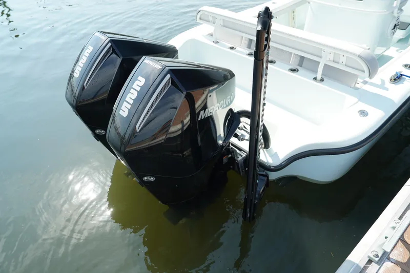  Yacht Photos Pics 2020 Yellowfin 26 Hybrid boat with dual Mercury outboard engines on water.