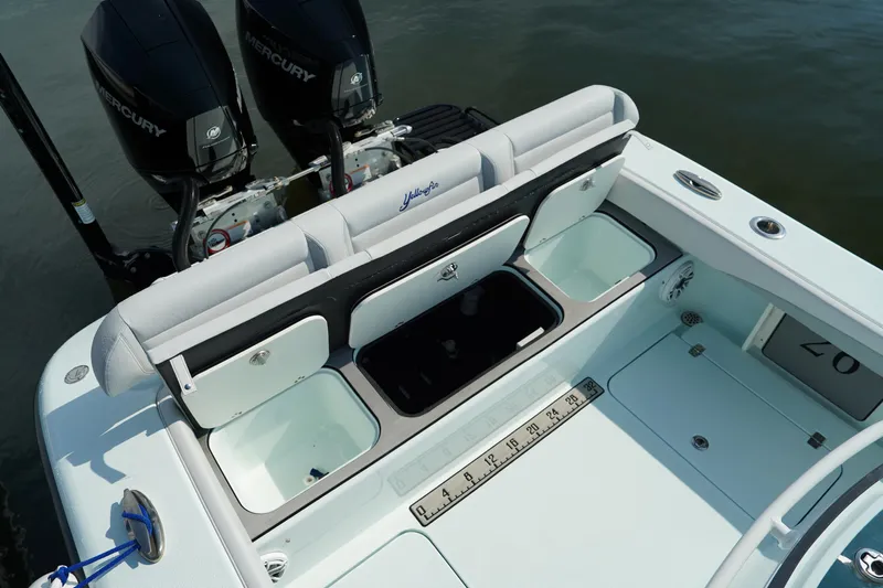  Yacht Photos Pics 2020 Yellowfin 26 Hybrid boat with open storage compartments and dual Mercury engines.