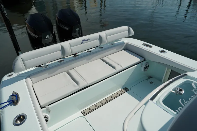  Yacht Photos Pics 2020 Yellowfin 26 Hybrid boat with cushioned seating and dual Mercury engines.