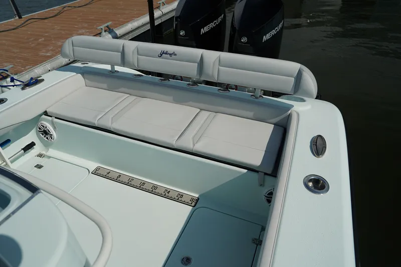  Yacht Photos Pics 2020 Yellowfin 26 Hybrid boat with cushioned seating and dual Mercury engines.