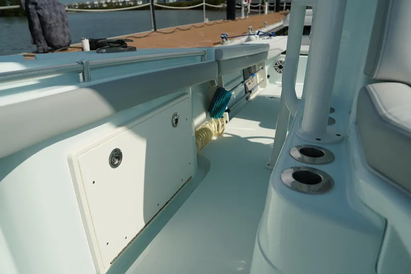  Yacht Photos Pics 2020 Yellowfin 26 Hybrid boat interior with storage compartments and rod holders.