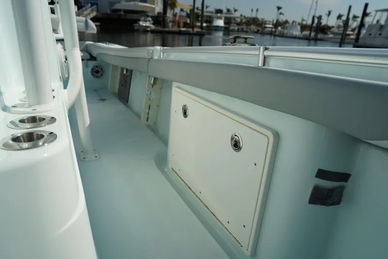  Yacht Photos Pics 2020 Yellowfin 26 Hybrid boat interior with storage compartments and cup holders.