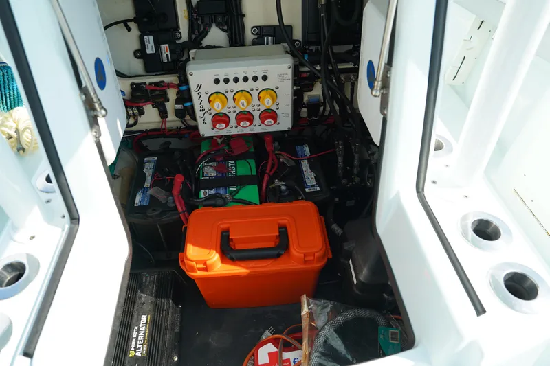  Yacht Photos Pics 2020 Yellowfin 26 Hybrid boat interior with electrical components and orange storage box.