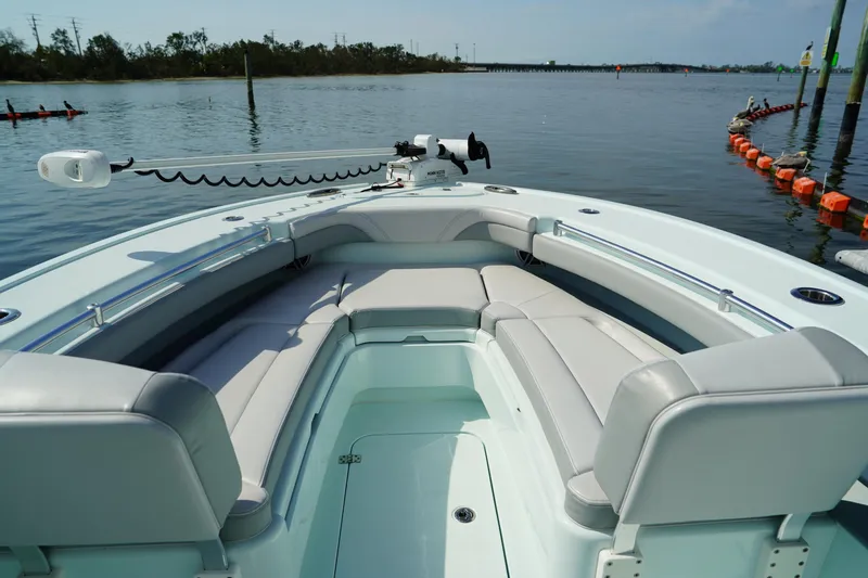  Yacht Photos Pics 2020 Yellowfin 26 Hybrid boat with spacious seating on calm water.