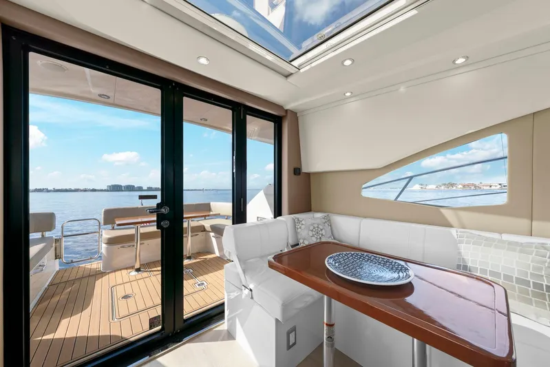 Nauti-lin Yacht Photos Pics Interior of 2016 Carver C37 Coupe yacht with elegant seating and ocean view.