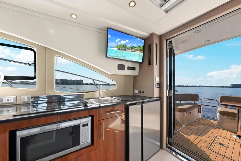 Nauti-lin Yacht Photos Pics Interior of 2016 Carver C37 Coupe yacht with modern kitchen and scenic water view.