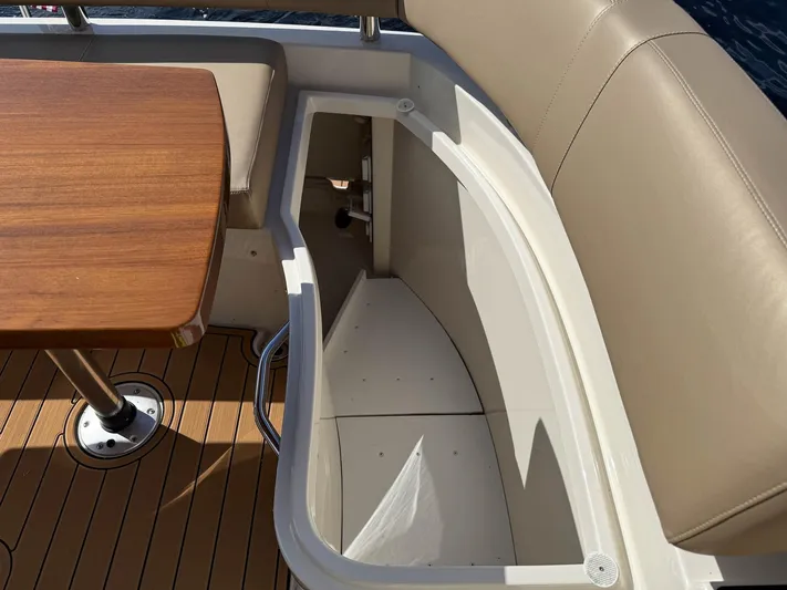 Nauti-lin Yacht Photos Pics Interior seating and table on a 2016 Carver C37 Coupe yacht.