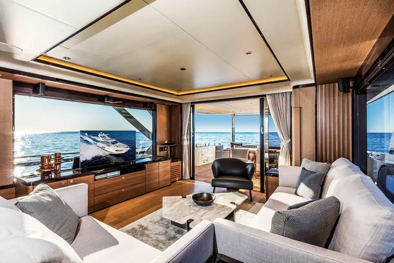  Yacht Photos Pics Luxurious interior of 2019 Absolute Navetta 73 yacht with ocean view and modern furnishings.