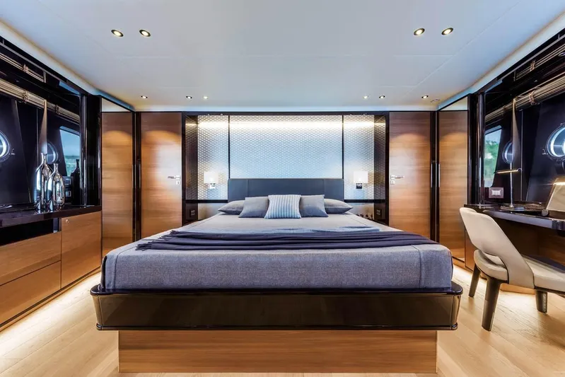  Yacht Photos Pics Luxurious bedroom interior of 2019 Absolute Navetta 73 yacht, featuring modern design and elegant furnishings.