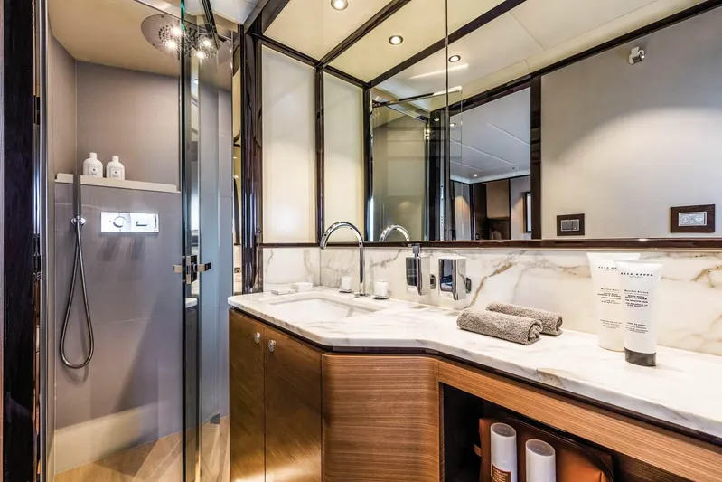  Yacht Photos Pics Luxurious bathroom in 2019 Absolute Navetta 73 yacht with modern fixtures and elegant design.