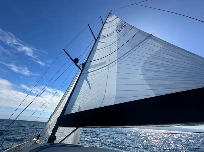 Juul Yacht Photos Pics Sailing yacht CNB 66 (2019) with sails unfurled on a sunny day at sea.