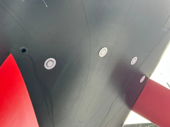 Juul Yacht Photos Pics Hull of CNB 66 yacht, 2019 model, featuring underwater lights and red keel.