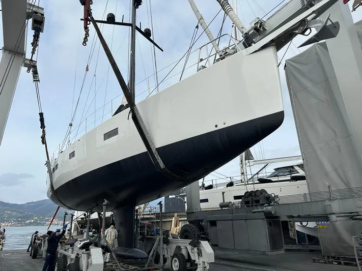 Juul Yacht Photos Pics 2019 CNB 66 yacht being lifted at a marina dock.