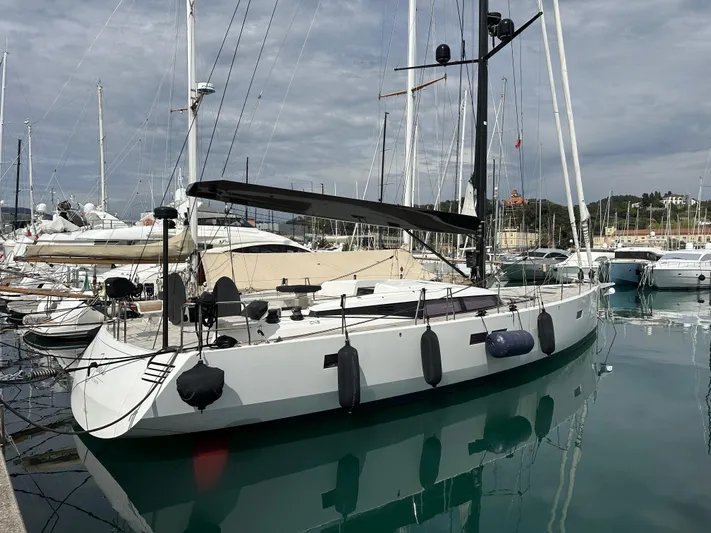 Juul Yacht Photos Pics 2019 CNB 66 yacht docked in marina, sleek design, calm water reflection.