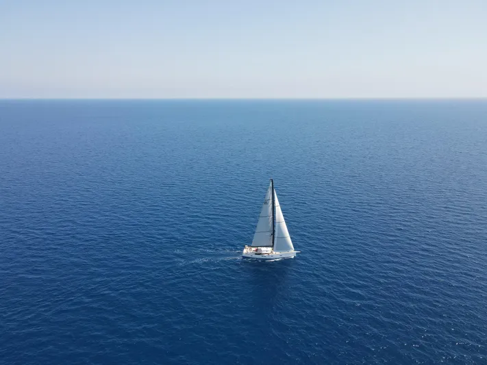 Juul Yacht Photos Pics Sailboat CNB 66 (2019) navigating open sea under clear blue sky.