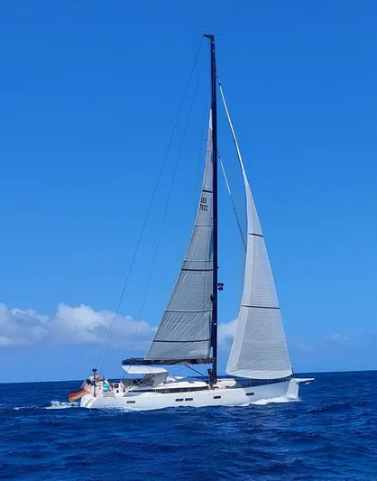Juul Yacht Photos Pics Sailing yacht CNB 66 (2019) cruising on open sea under clear blue sky.