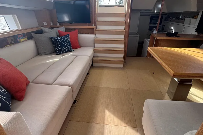 Juul Yacht Photos Pics Luxurious interior of 2019 CNB 66 yacht with modern seating and elegant decor.