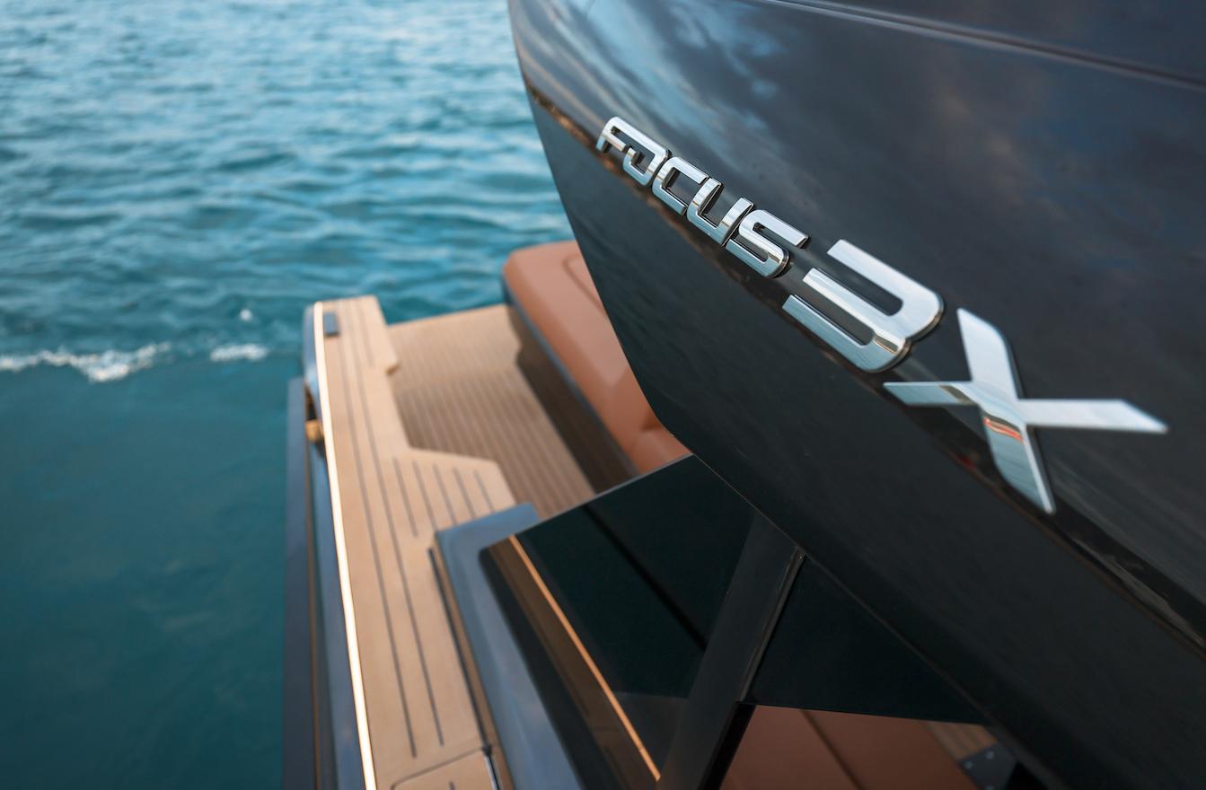 2026 Focus 3X boat on water, showcasing sleek design and branding.