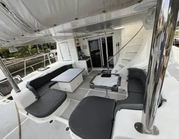 Insta Gator Yacht Photos Pics Luxurious 2017 Royal Cape Catamarans Majestic 53 yacht interior with seating and table.