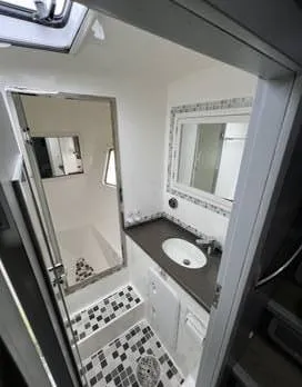 Insta Gator Yacht Photos Pics 2017 Royal Cape Catamarans Majestic 53 bathroom with modern fixtures and mosaic tile design.