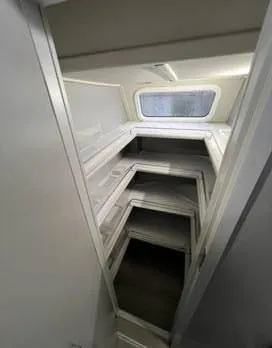 Insta Gator Yacht Photos Pics Interior view of 2017 Royal Cape Catamarans Majestic 53, featuring a compact bunk bed setup.