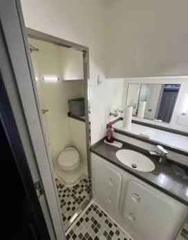 Insta Gator Yacht Photos Pics Bathroom interior of 2017 Royal Cape Catamarans Majestic 53 with modern fixtures and tiled floor.