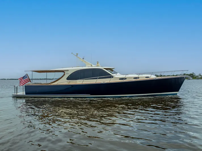 Zephyr Yacht Photos Pics 2018 Palm Beach Motor Yachts PB55 on calm water, side view.