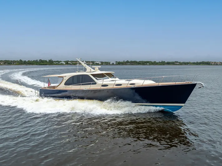 Zephyr Yacht Photos Pics 2018 Palm Beach Motor Yachts PB55 cruising on open water, showcasing sleek design and performance.