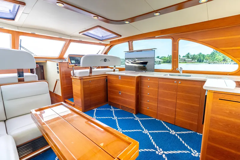 Zephyr Yacht Photos Pics Luxurious interior of 2018 Palm Beach Motor Yachts PB55 with elegant wood finishes and modern amenities.