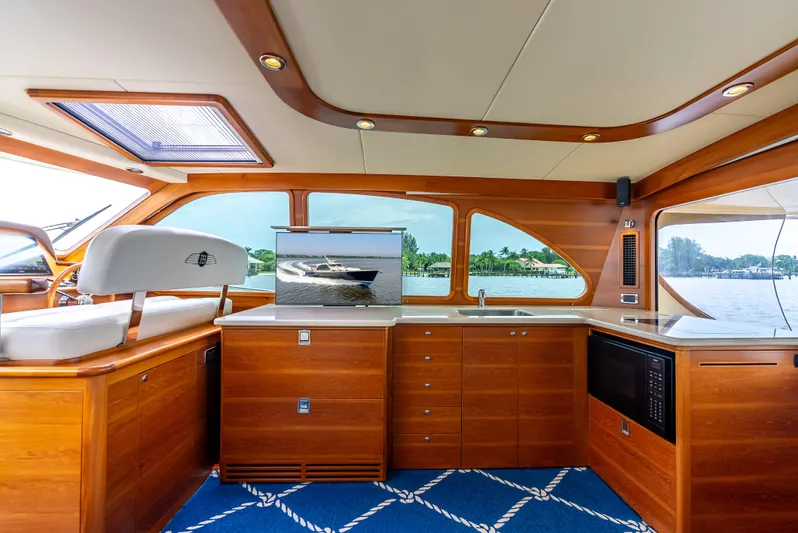 Zephyr Yacht Photos Pics Luxurious interior of 2018 Palm Beach Motor Yachts PB55, featuring elegant wood finishes and modern amenities.