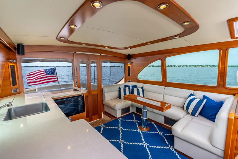 Zephyr Yacht Photos Pics Luxurious interior of 2018 Palm Beach Motor Yachts PB55 with elegant seating and ocean view.