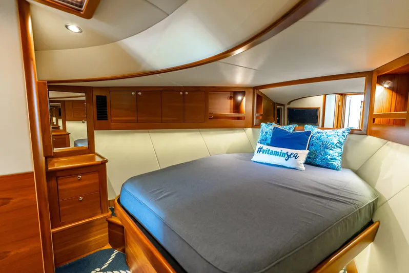 Zephyr Yacht Photos Pics Luxurious cabin interior of 2018 Palm Beach Motor Yachts PB55 with elegant wood finish.