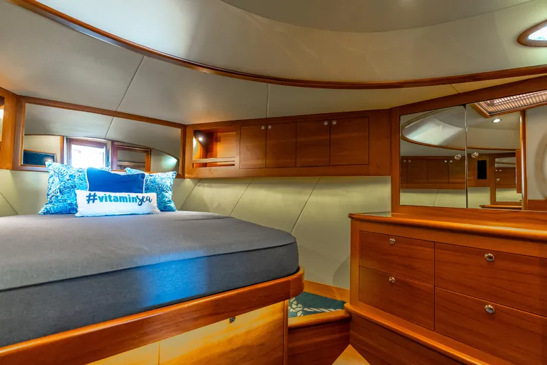 Zephyr Yacht Photos Pics Luxurious 2018 Palm Beach Motor Yachts PB55 cabin with elegant wood finish and cozy bedding.