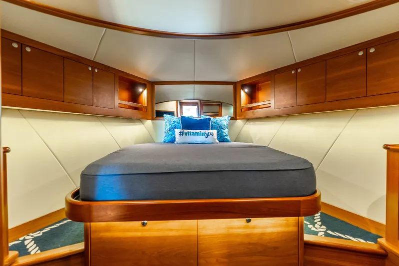 Zephyr Yacht Photos Pics Luxurious cabin interior of 2018 Palm Beach Motor Yachts PB55 with elegant wood finish.