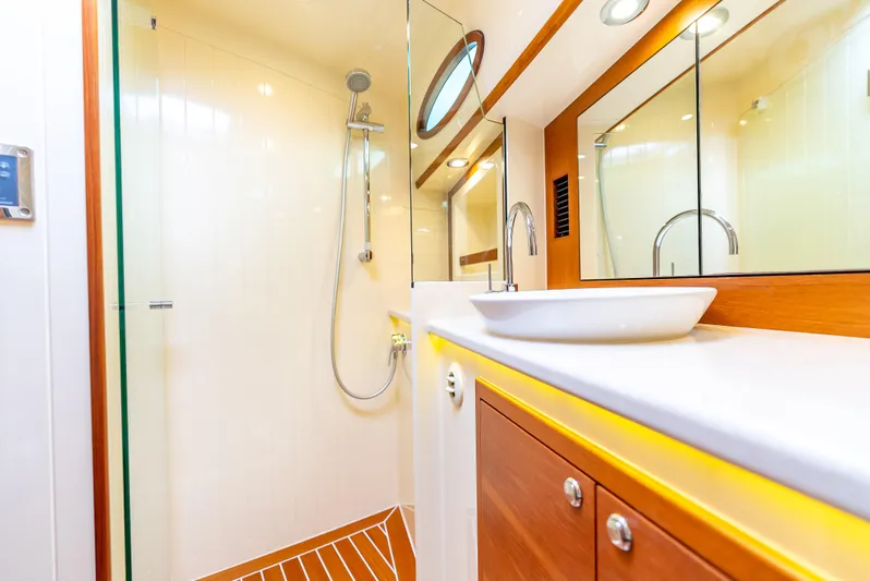 Zephyr Yacht Photos Pics Luxurious bathroom interior of 2018 Palm Beach Motor Yachts PB55 with modern fixtures.