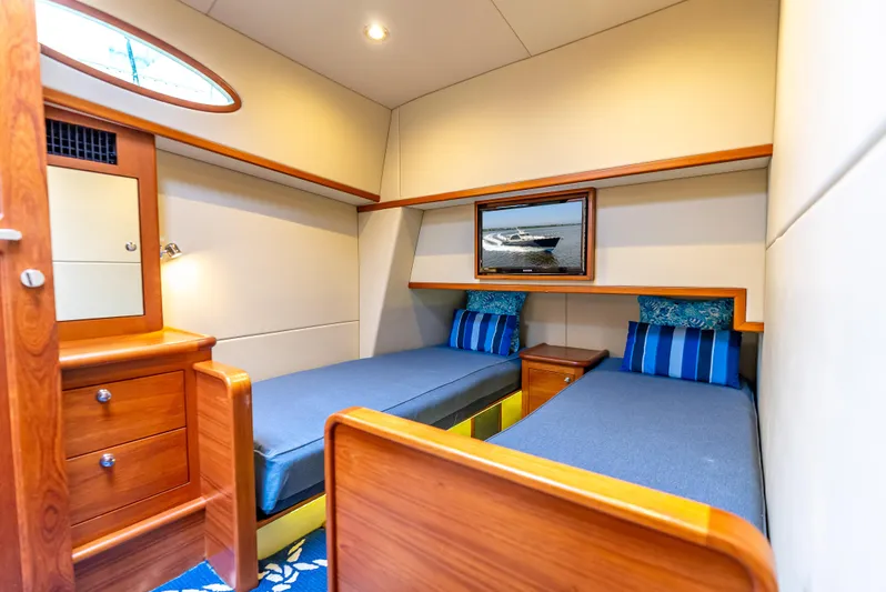 Zephyr Yacht Photos Pics Luxurious 2018 Palm Beach Motor Yachts PB55 cabin with twin beds and elegant wood finish.