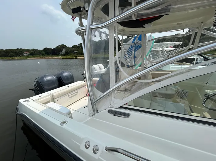 Good Sport Yacht Photos Pics 2011 Hydra-Sports 3000 VX boat docked with dual engines, clear canopy, and scenic background.